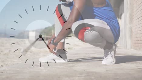 Animation-Der-Uhr-über-Einem-Afroamerikanischen-Mann,-Der-Vor-Dem-Laufen-Schuhe-Bindet