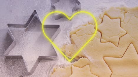 Animation-of-neon-heart-over-cookies-dough-and-mold