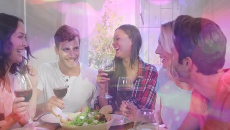 Animation-of-bokeh-over-happy-caucasian-female-and-male-friends-drinking-wine-and-talking