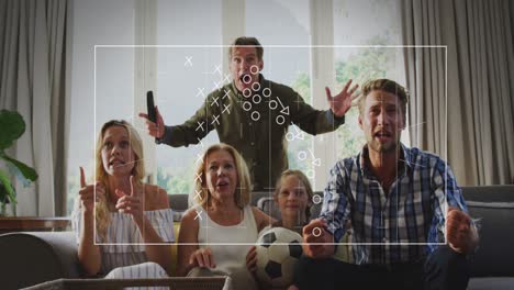 Animation-of-crosses-and-circles-over-happy-caucasian-family-watching-soccer-match