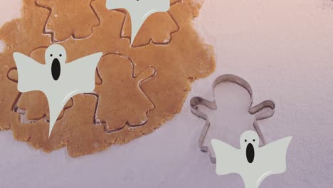 Animation-of-ghosts-over-cookies-dough-and-mold