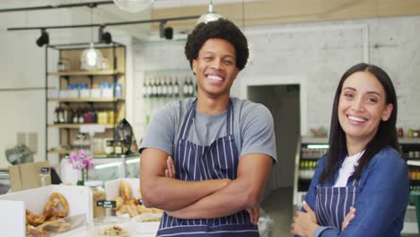 Animation-of-happy-diverse-female-and-male-waiters-at-coffee-shop