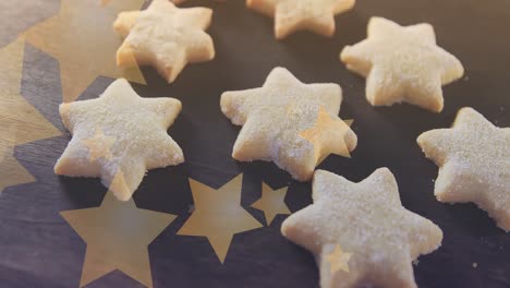 Animation-of-stars-floating-over-homemade-cookies