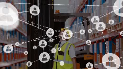 Animation-of-network-of-network-of-connected-people-icons-over-caucasian-male-worker-in-warehouse