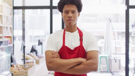 Animation-of-happy-biracial-waiter-standing-in-coffee-shop