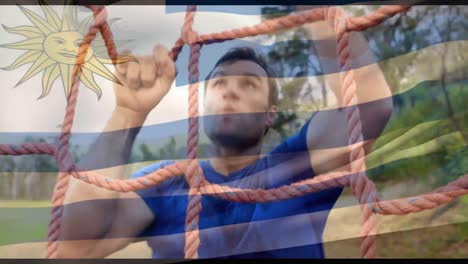 Animation-of-flag-of-argentina-over-caucasian-man-during-obstacle-race-training