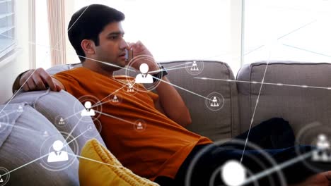 Animation-of-network-of-connections-over-caucasian-man-using-smartphone