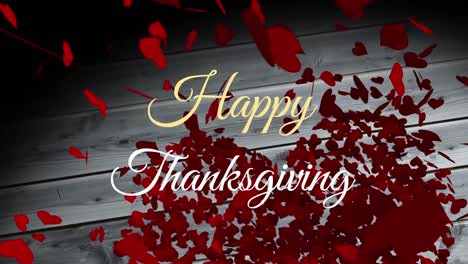 Animation-of-happy-thanksgiving-text-over-hearts-on-wooden-background