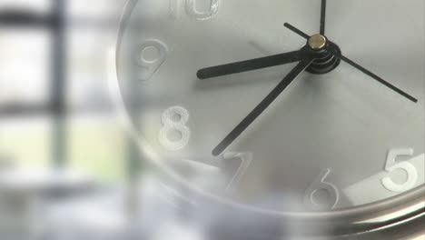 Animation-of-clock-moving-over-blurred-office-in-background