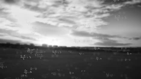 Animation-of-maths-equations-moving-over-black-and-white-countryside-and-cloudy-sky-background