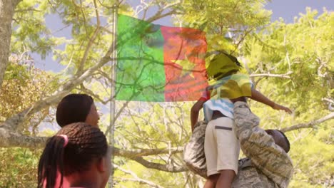 Animación-De-La-Bandera-De-Camerún-Sobre-El-Feliz-Padre-Soldado-Afroamericano-Y-Su-Familia-Abrazándose.