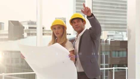 Animation-of-caucasian-male-and-female-engineers-over-cityscape