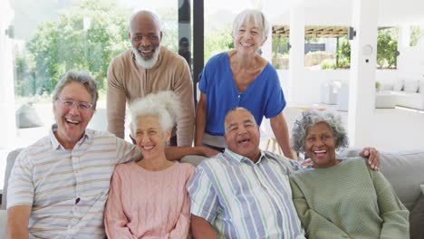 Portrait-of-senior-diverse-people-embracing-at-retirement-home