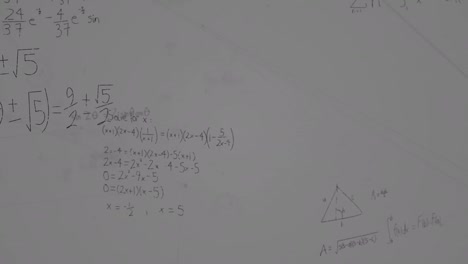 Animation-of-mathematical-formulas-over-grey-background