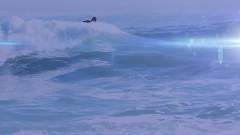 Animation-of-lights-over-caucasian-male-surfboarding-on-waves