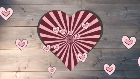Animation-of-rotating-red-striped-background-over-heart-shapes-hole-in-beige-wooden-surface