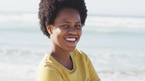 Portrait-of-happy-african-american-woman-on-sunny-beach