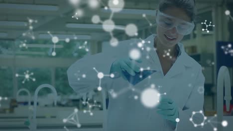 Animation-of-molecules-over-biracial-female-scientist-in-lab