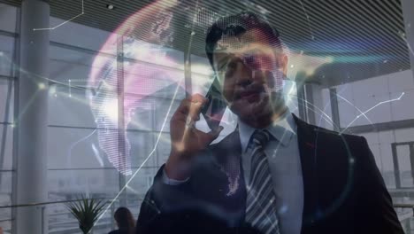 Animation-of-globe-and-connections-over-biracial-businessman-using-smartphone