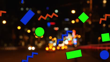 Animation-of-diverse-geometrical-shapes-moving-over-blurred-night-cityscape