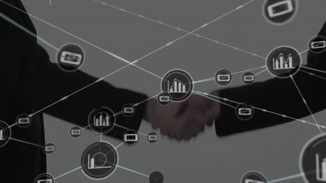 Animation-of-network-of-connections-with-icons-over-people-shaking-hands