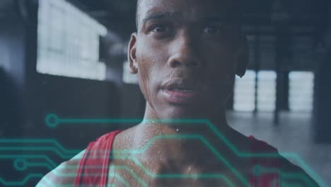 Animation-Der-Datenverarbeitung-über-Einem-Afroamerikanischen-Sportler,-Der-Seine-Smartwatch-überprüft