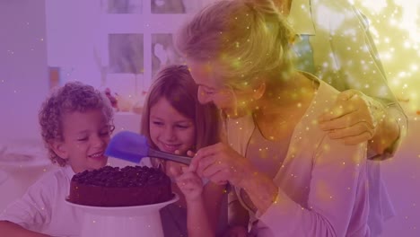Animation-of-sparkles-over-happy-caucasian-grandparents-and-grandchildren-making-cake
