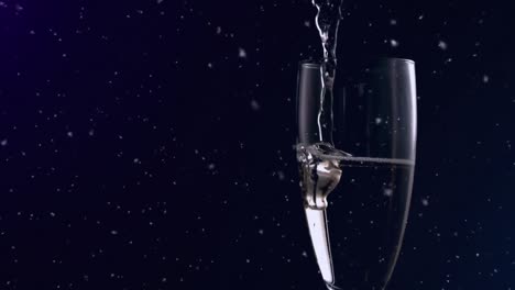 Animation-of-falling-confetti-over-glass-of-champagne-on-dark-background
