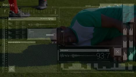 Interface-with-data-processing-against-injured-african-american-male-soccer-player-holding-his-leg