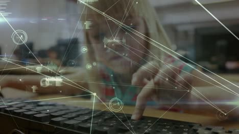 Animation-of-network-of-connections-over-caucasian-schoolgirl-using-computer-in-classroom