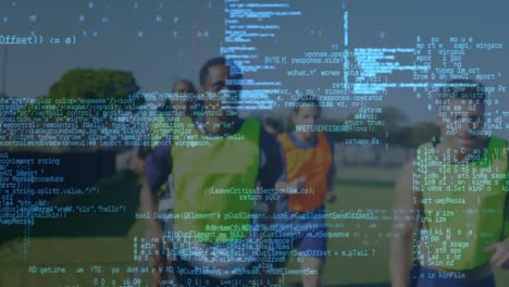 Data-processing-against-team-of-male-soccer-players-running-on-sports-field
