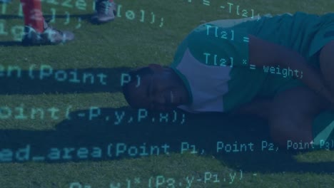 Data-processing-against-injured-african-american-male-soccer-player-holding-his-leg-on-sports-field