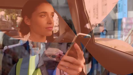 Animation-of-biracial-woman-using-smartphone-over-caucasian-male-worker-in-warehouse