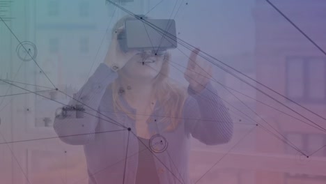 Animation-of-connections-over-caucasian-woman-using-vr-headset
