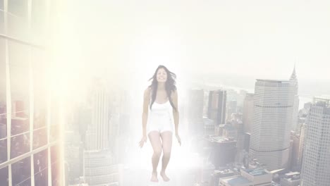 Animation-of-cityscape-over-biracial-woman-jumping-with-arms-outstretched