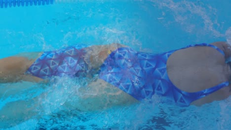 Animation-of-caucasian-female-sports-swimmer-in-swimming-pool-over-caucasian-female-swimmer-swimming