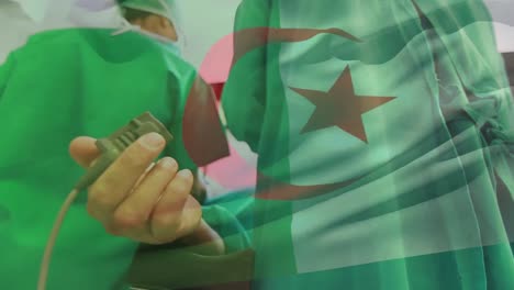 Animation-of-flag-of-algeria-over-surgeons-with-caucasian-patient