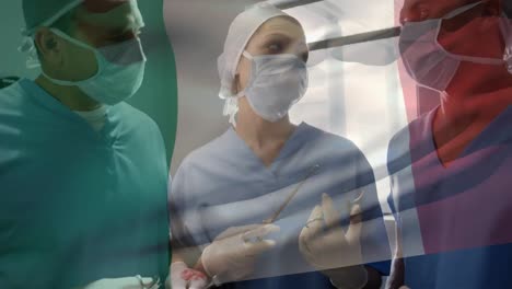Animation-of-flag-of-france-over-diverse-doctors-during-surgery