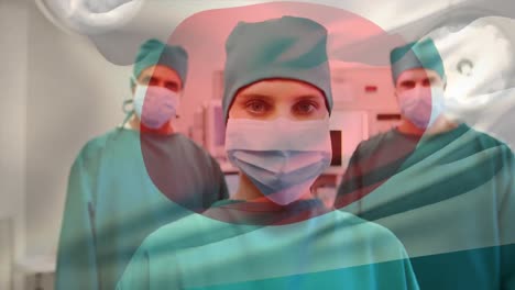 Animation-of-flag-of-japan-over-diverse-doctors-with-face-masks