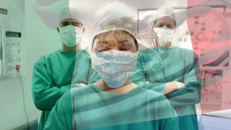 Animation-of-flag-of-italy-over-diverse-doctors-with-face-masks