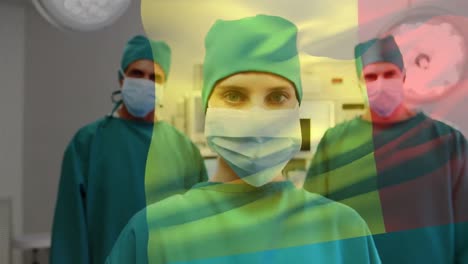 Animation-of-flag-of-france-over-diverse-doctors-with-face-masks