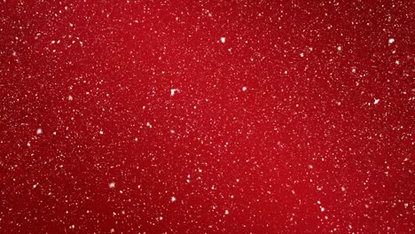 Animation-of-snow-falling-in-seamless-loop-over-red-background