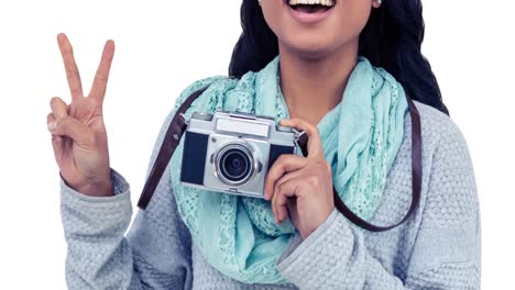 Animation-of-happy-asian-woman-holding-camera-over-white-background