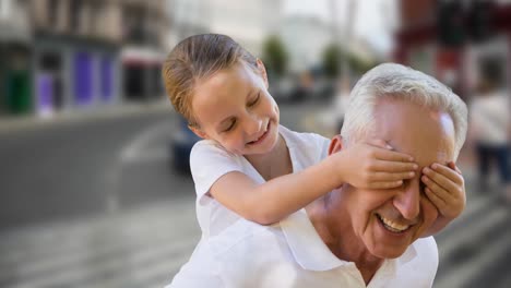 Animation-of-happy-senior-caucasian-man-with-granddaughter-over-city