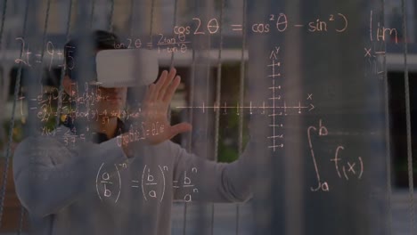 Animation-of-mathematical-equations-over-biracial-man-using-vr-headset