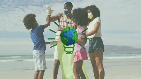 Animation-Des-Globus-über-Einer-Afroamerikanischen-Familie-Mit-Gesichtsmasken,-Die-Am-Sonnigen-Strand-Müll-Sammelt