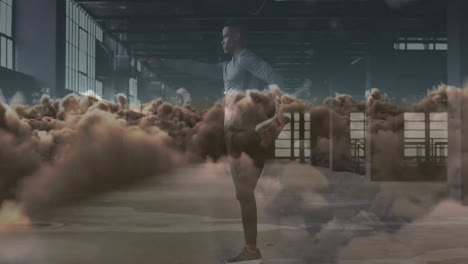 Animation-of-clouds-over-african-american-sportsman-exercising
