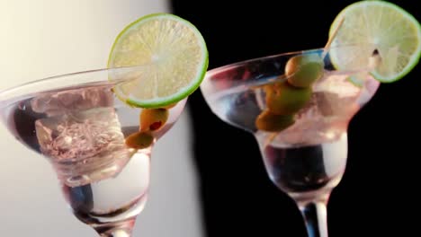 Video-of-glasses-of-martini-on-white-and-black-background