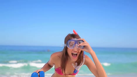 Video-of-do-it-for-them-over-happy-caucasian-woman-with-snorkeling-mask-on-beach