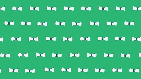 Animation-of-bow-ties-floating-over-green-background